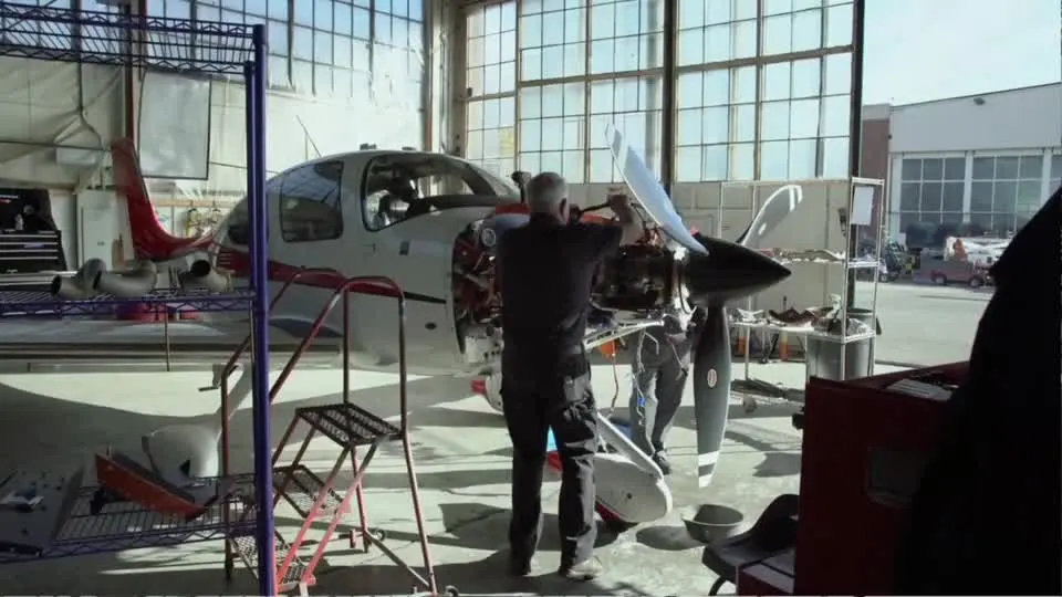 An aircraft being serviced in a hangar