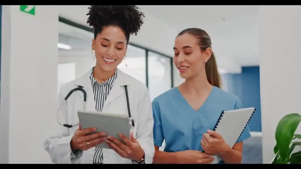 Healthcare professionals reviewing a tablet together