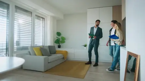 Property professionals showing an apartment